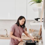 woman cooking in kitchen